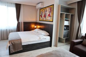 A bed or beds in a room at SAR-PER Hotel
