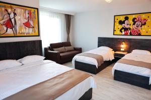 A bed or beds in a room at SAR-PER Hotel