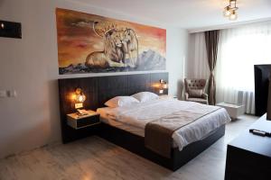 A bed or beds in a room at SAR-PER Hotel