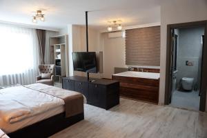 A bed or beds in a room at SAR-PER Hotel