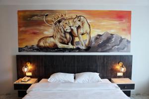 A bed or beds in a room at SAR-PER Hotel