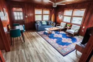 a living room with a couch and a table at Endless Summer in Carolina Beach