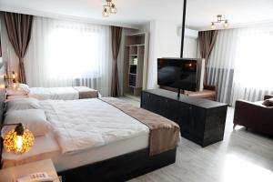 A bed or beds in a room at SAR-PER Hotel
