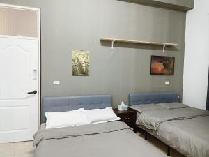 Postel nebo postele na pokoji v ubytování 阿布の家