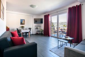 a living room with a couch and a table at California Apartments in Dubrovnik