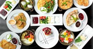 a bunch of plates of food on a table at Istanbul Airport Express Hotel in Arnavutköy +23 photos