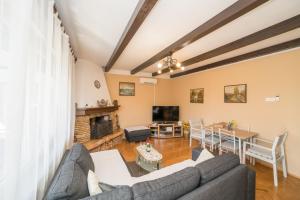 a living room with a couch and a table at Red Karmenita in Umag