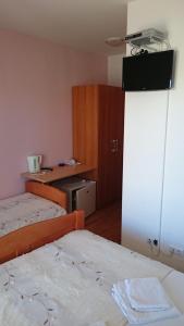 Postel nebo postele na pokoji v ubytování Guest House Lav