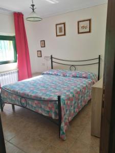 a bedroom with a bed in a room at My Nest in Arzachena +10 photos
