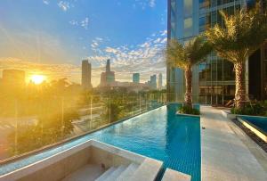 a swimming pool on a building with a view of the city at Morden 2brs apartment at Empire City in Ho Chi Minh City