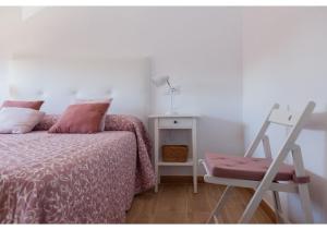 A bed or beds in a room at Apartamento Felisa A