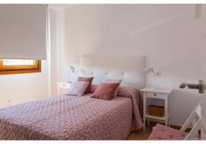 A bed or beds in a room at Apartamento Felisa A