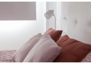 A bed or beds in a room at Apartamento Felisa A