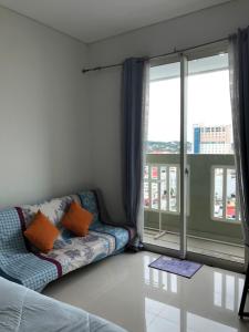 O zonă de relaxare la BORNEOBAY CITY Apartment near Balikpapan Plaza
