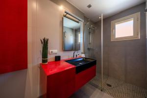 a bathroom with a red sink and a shower at M4R Casa Iuca in Alcudia +19 photos