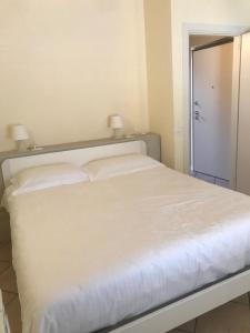 Posteľ alebo postele v izbe v ubytovaní Flowers Apartments