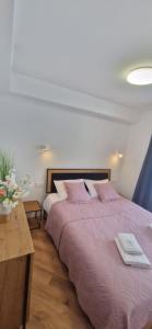 Posteľ alebo postele v izbe v ubytovaní Apartament 17 SzklarSki