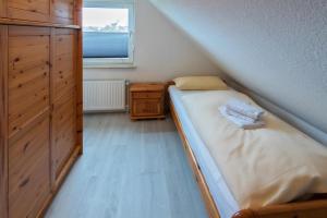 Postel nebo postele na pokoji v ubytování Ferienhaus-Lucy