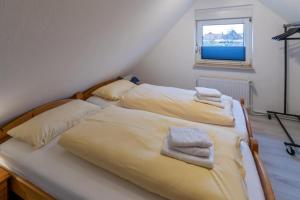 Postel nebo postele na pokoji v ubytování Ferienhaus-Lucy