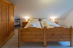 Postel nebo postele na pokoji v ubytování Ferienhaus-Lucy