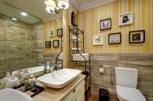 a bathroom with a sink and a toilet and a shower at German18-3B Luxury Vilnius apartment in Vilnius +33 photos