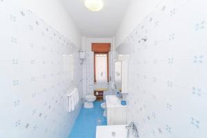 a bathroom with two sinks and a toilet at "Conchiglia" big house in the center of Maiori in Maiori +53 photos