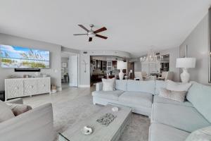 a living room with a white couch and a table at Bella Luna 902-New Rental-3bd/3bath-Upscale Luxury in Orange Beach