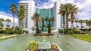 a resort with a fountain in front of a building at Bella Luna 902-New Rental-3bd/3bath-Upscale Luxury in Orange Beach
