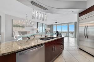 a kitchen with a sink and a counter top at Bella Luna 902-New Rental-3bd/3bath-Upscale Luxury in Orange Beach