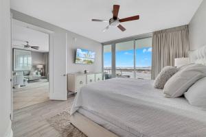 a bedroom with a bed and a ceiling fan at Bella Luna 902-New Rental-3bd/3bath-Upscale Luxury in Orange Beach +88 photos