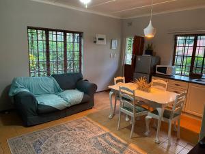 a living room with a couch and a table at at 22 Symmonds in Melmoth