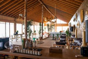 a large room with tables and chairs in a building at Desert Sands Dakhla Lagoon View & Kitesurf Spot in Dakhla