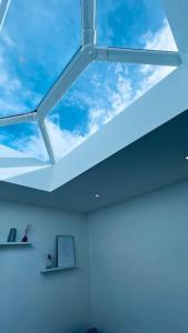 a skylight in the ceiling of a room at Contemporary studio apartment in Pemberton
