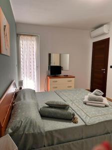 Кровать или кровати в номере Villetta Gioia