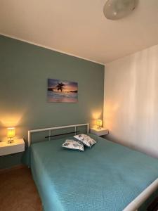 Ein Bett oder Betten in einem Zimmer der Unterkunft Villetta Gioia