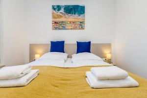 Posteľ alebo postele v izbe v ubytovaní Apartments LUCA