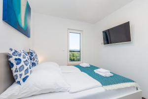 Posteľ alebo postele v izbe v ubytovaní Apartments LUCA