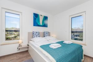 Posteľ alebo postele v izbe v ubytovaní Apartments LUCA