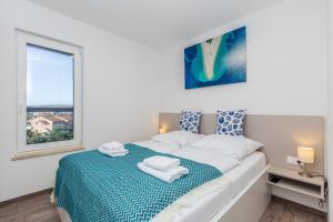 Posteľ alebo postele v izbe v ubytovaní Apartments LUCA