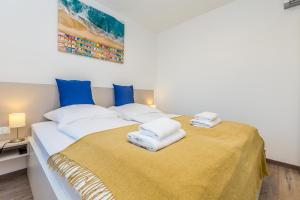 Posteľ alebo postele v izbe v ubytovaní Apartments LUCA