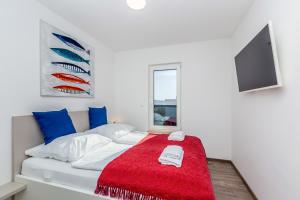 Posteľ alebo postele v izbe v ubytovaní Apartments LUCA