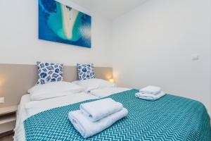 Posteľ alebo postele v izbe v ubytovaní Apartments LUCA