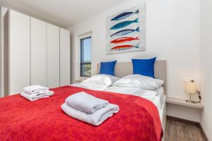 Posteľ alebo postele v izbe v ubytovaní Apartments LUCA