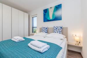 Posteľ alebo postele v izbe v ubytovaní Apartments LUCA