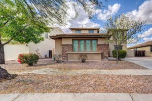 a house with a driveway in front of it at Updated Gilbert Home with Pool and Community Amenities in Queen Creek