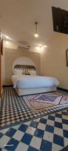Postel nebo postele na pokoji v ubytování Riad Amor - Suite & Spa