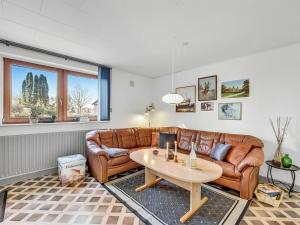 a living room with a couch and a table at Apartment Gertraude - 17km to the inlet in Western Jutland by Interhome in Skjern