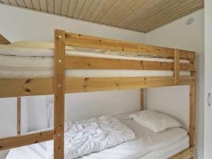 a couple of bunk beds in a room at Holiday Home Pinja - 40km from the sea in SE Jutland by Interhome in Silkeborg