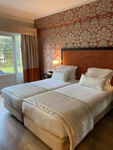 Cama ou camas em um quarto em Hotel Inglaterra - Charme & Boutique