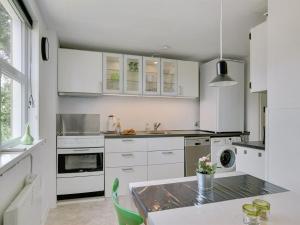 A kitchen or kitchenette at Holiday Home Øthi in Western Jutland by Interhome